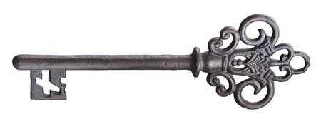 Old rusty door key isolated on white.の写真素材