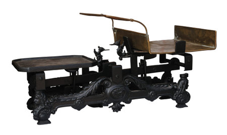 Old metal two pan balance isolated on whiteの写真素材