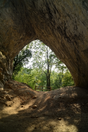 Entrance of prehistoric man's cave seen from the inside (Istalosko, Szilvasvarad, Hungary).の写真素材