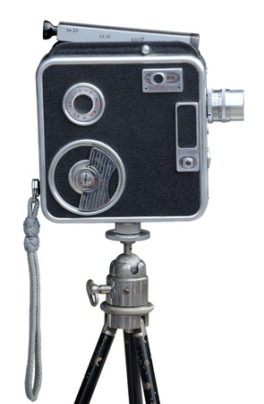 Old movie camera on tripod, isolated on white.の写真素材