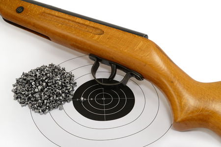 Sport shooting equipment on target. Air-gun and bullets.の写真素材