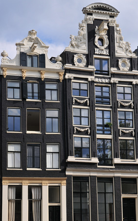 A Canal house facade with a lifting hook in Amsterdam.のeditorial素材