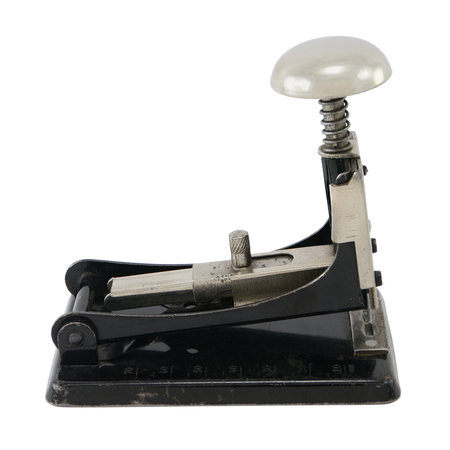 Old-fashioned black metal stapler, isolated on white.の写真素材