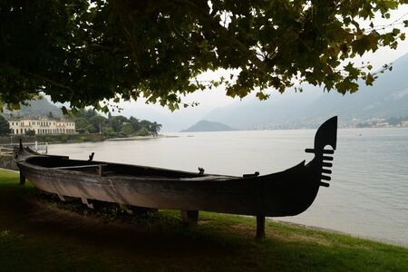 Old gondola in the gardens of Villa Melzi, one of the most beautiful tourist attractions in Bellagio (Lake Como, Lombardy, Italy).の写真素材