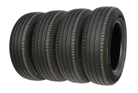 Four summer tires for car isolated on white.の写真素材