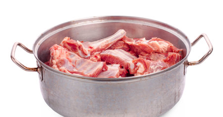 Raw spare ribs on white background
