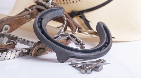 HorseShoe rusty steel isolated on whiteの写真素材