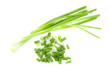 chopped green onions on white backgroundの写真素材