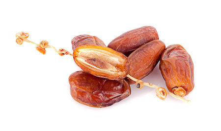 dried fruits from date palm isolated on white background