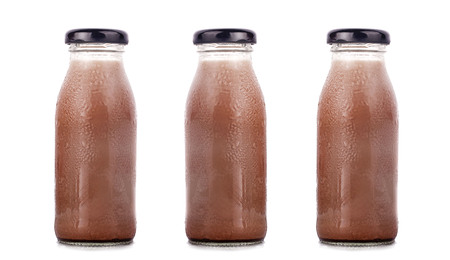 Various flavors of milk in bottles with chocolateの写真素材