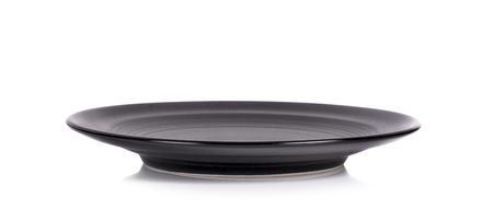 Black plate isolated on white backgroundの写真素材