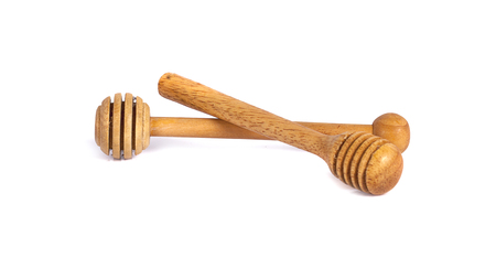 Honey dipper or spoon made from wooden isolated on white backgroundの写真素材