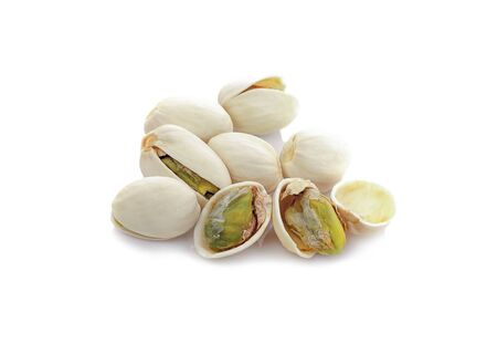 pistachioes isolated on white backgroundの写真素材