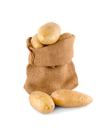 Ripe potatoes in burlap sack isolated on white backgroundの写真素材