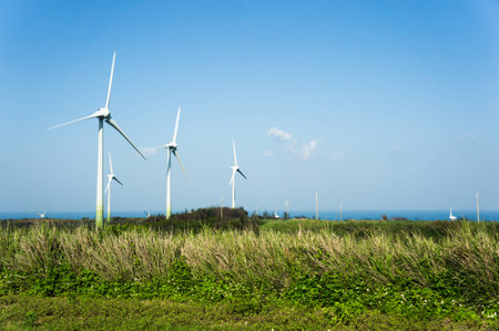 Wind turbine between fieldsの写真素材