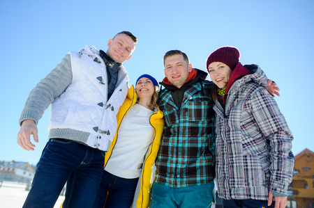 Cheerful group of friends posing for the camera. Two young men and two girl. All good mood. Friends are hugging and laughing merrily.の写真素材