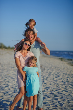 Young happy family on the beach.の写真素材