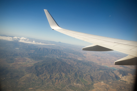 View from the airplane window. Beautiful scenery from an unexpected perspective. Terraneous objects seem to be toy.の写真素材