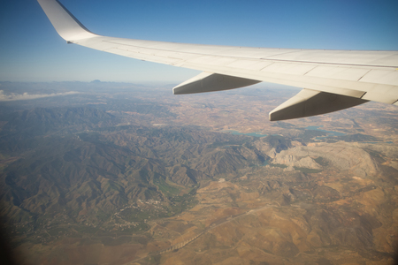 View from the airplane window. Beautiful scenery from an unexpected perspective. Terraneous objects seem to be toy.の写真素材