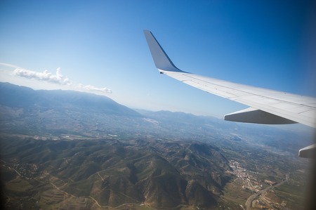 View from the airplane window. Beautiful scenery from an unexpected perspective. Terraneous objects seem to be toy.の写真素材