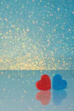 Valentines background. Red and blue Heart on table with reflection on it.  Valentine day love concept. Lovely photo.の写真素材