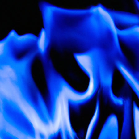 Blue fire flames on black background, close-up. Abstract backgroundの素材