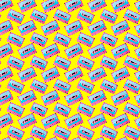 Seamless pattern with colorful retro audio cassettes on yellow backgroundの写真素材