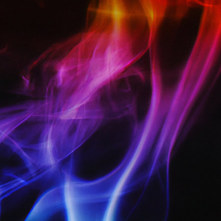 abstract multicolored smoke on a black background close-upの素材