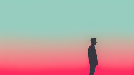 Silhouette of a man walking in front of a sunset.の素材