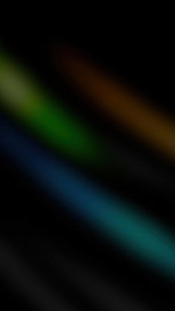 Three distinct colored light streaks blue green and orange diagonally traverse a deep black void creating an abstract visual effectの写真素材