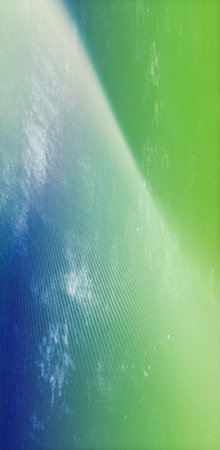 A vibrant abstract background featuring a gradient of blue, green, and white, creating a smooth and visually appealing texture.の写真素材