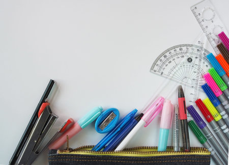 School supplies Placed on a white background in the top view pattern And have free space.