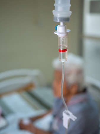Close up saline solution drip for patient in hospital. Health and medical equipment.の写真素材