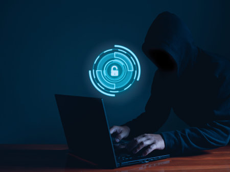 Hackers work on laptop in the dark. The concept of information security in the Internet network and...