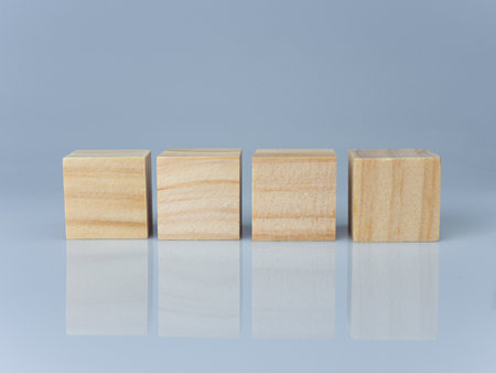 empty wooden blocks lined up on a white background. Business concept.の写真素材