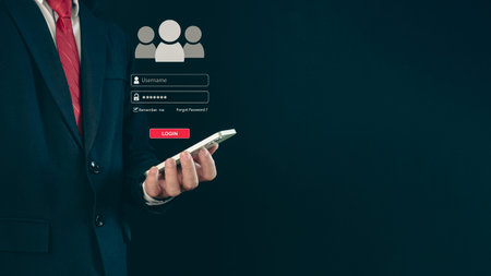 Login. A businessman's finger is holding a phone. Represents protection against external hacks....