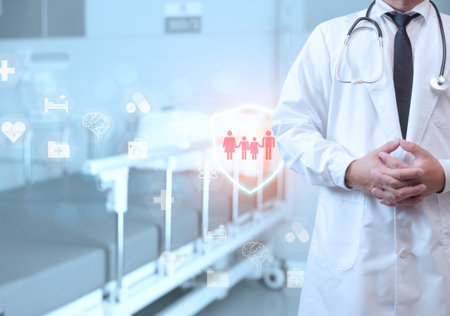 A doctor in a lab coat is standing on the background inside a hospital. Medical concept. Medical information search concept. The concept of treating disease. Insurance concept.の写真素材