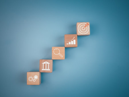 Wood cube block stacking with icon.Concept of business strategy and goal action plan.の写真素材
