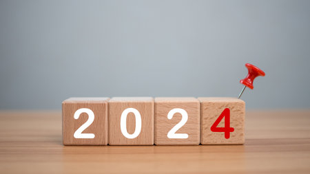 Wooden blocks lined up with the letters 2024. Represents the goal setting for 2024, the concept of a start. financial planning development strategy business goal settingの写真素材