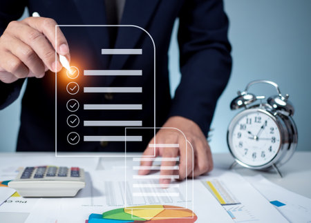 Businessman is checklist and filling survey form online. Document management system, DMS.  Quality control and accuracy Checkの写真素材