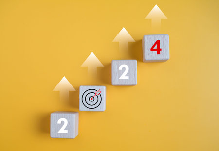 Wooden blocks lined up with the letters 2024. Represents the goal setting for 2024, the concept of a...