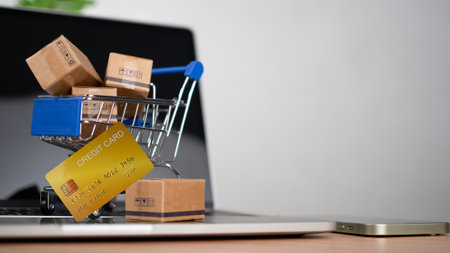 Shopping carts and credit card Place on laptop computer repressents online shopping concept, website, e-commerce, market platform, technology and online payment concept.の写真素材