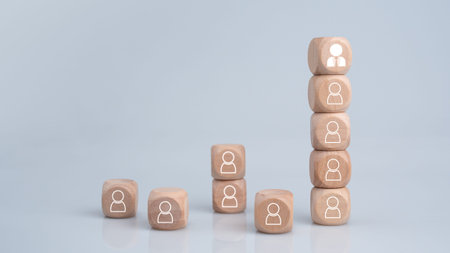The HRM concept represents leadership and team leadership. One wooden block is different and stands...