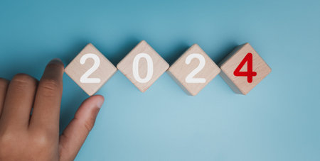 Wooden blocks lined up with the letters 2024. Represents the goal setting for 2024, the concept of a...