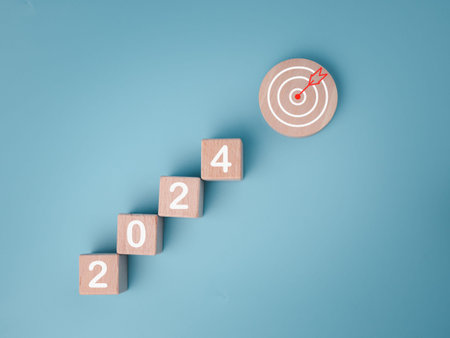 Wooden blocks lined up with the letters 2024. Represents the goal setting for 2024, the concept of a...