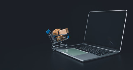 Boxes in a shopping car on a laptop keyboard. Ideas about online shopping, online shopping is a form of electronic commerce that allows consumers to directly buy goods from seller over the internet.の写真素材