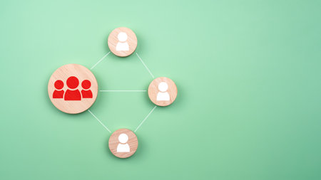 Circular wood with printed target icons and business symbols on light blue background, business goals and objectives concept, business competition, Customer relationship management concept.の写真素材