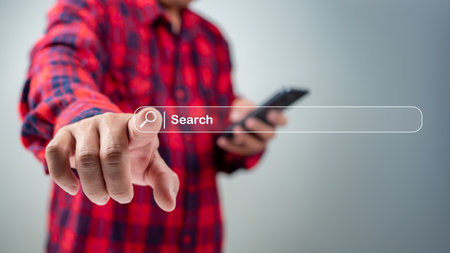 Man use cell phone to search data on internet finding information Website online, Search Engine Optimization, Searching information online, Concept of SEO, Search Engine Optimization.の写真素材