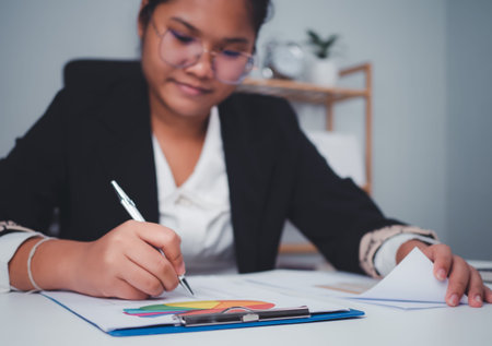 Business woman people use computers and paper documents to analyze business and manage corporate...