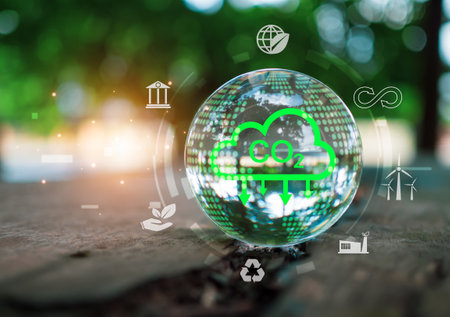 Glass sphere with CO2 cloud on it. Glass sphere on wooden background with various icons and symbols. Scene is one of environmental awareness and concern for the planet. Reduce carbon dioxide by 2050.の写真素材